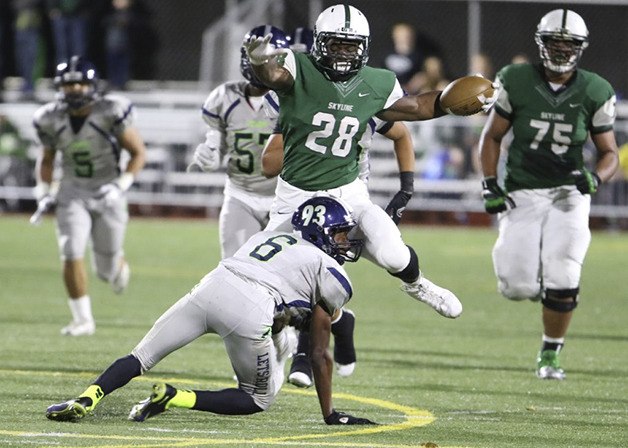 Skyline Spartans running back Rashaad Boddie runs over a Beamer defender in a matchup between the Skyline Spartans and Beamer Titans on Nov. 6. Skyline defeated Beamer 54-14