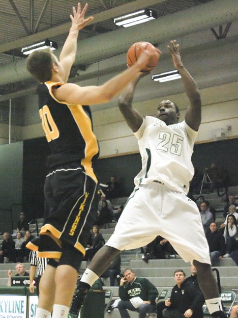 Skyline's Kasen Williams pulls up for a jumper over Inglemoor's Dan Johnson on Tuesday night. Williams scored 14 for the Spartans.