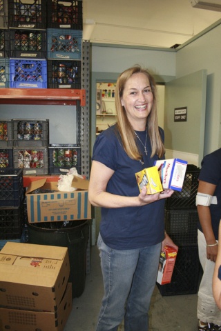 Heather Choco Sorts Food for Issaquah Food Bank as part of the Sammamish Presbyterian Church's 'We Can Do It!' campaign.