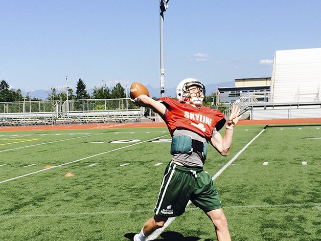 Skyline Spartans quarterback Blake Gregory hurls a pass toward an open wide receiver during a spring football practice session on June 11 at Skyline High School in Sammamish.