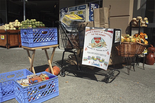 Crates and shopping carts held donations from the Mayor’s Month of Concern for the Hungry food drive at the Issaquah-Pine Lake QFC in Sammamish Sept. 12.