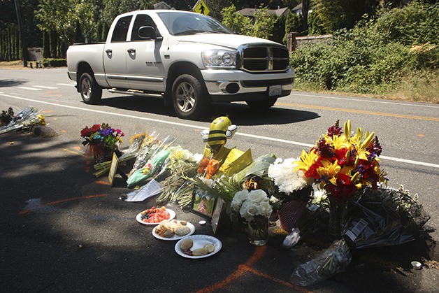 A roadside memorial was set up over the weekend on Newport Way outside the Northwest Oakcrest Drive where a car fatally struck a 4-year-old boy.