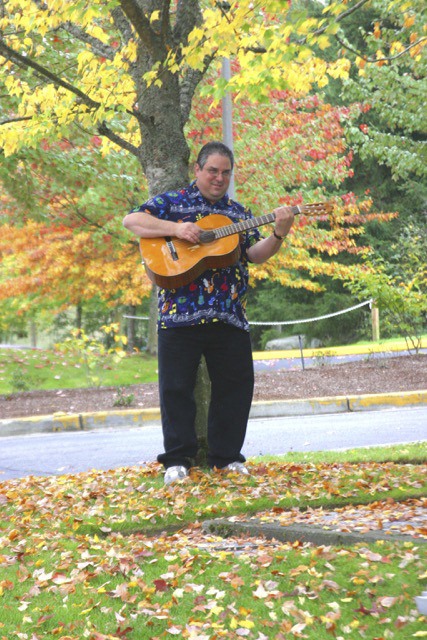 Glenn Lestz with his guitar.