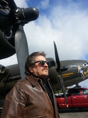 Dan O’Neill stands next to the refurbished version of the Memphis Belle