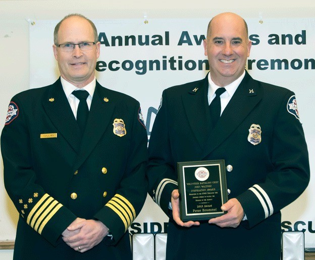 Battalion Chief Craig Hooper presented a Medal of Valor to Captain Pete Brummel