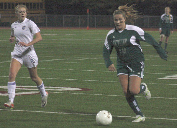 Skyline sophomore Brooke Bofto pushes the ball upfield against Tahoma defender Kaysha Darie.