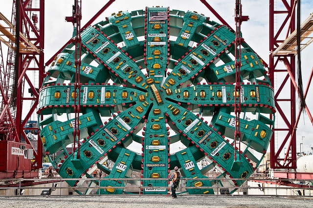 Suspended from a towering gantry crane