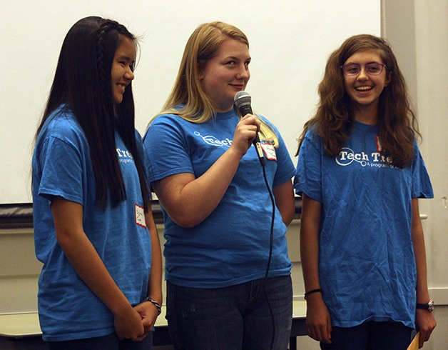 Issaquah Middle School student Audrey Davis discusses her favorite part of the Tech Trek STEM camp at Pacific Lutheran University. She is flanked by fellow campers Sylvie Cao (left) of Maywood Middle School and Sophie Serumgard (right) of Issaquah Middle School.