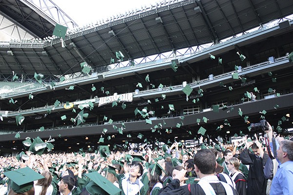 Skyline High School's class of 2013 toss their caps in the air to celebrate their victory.