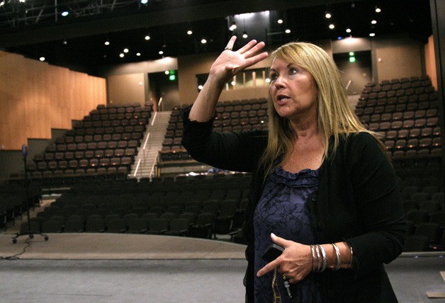 Principal Paula Phelps shows Issaquah High School's new theater.