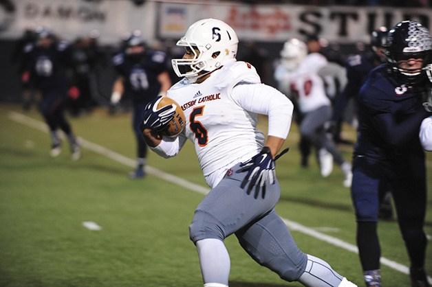 Eastside Catholic Crusaders wide receiver Devon Arbis-Jackson breaks into the secondary against Mount Spokane in the Class 3A semifinals on Nov. 29 in Spokane.