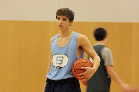 Junior guard Will Parker listens to defensive instructions in practice earlier this week.