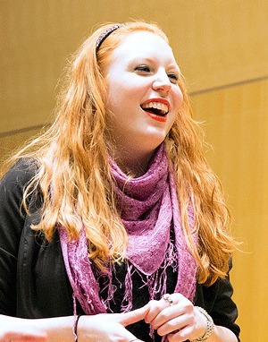 Central Washington University junior Aryn Chatterton rehearses as a member of CWU's mixed a cappella group Boots 'n' Cats in March 2014.