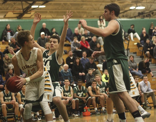 Skyline defenders surround a Redmond player in a battle between Class 4A KingCo rivals on Jan. 5. Redmond registered a 46-40 win against Skyline. Redmond improved their overall record to 7-5 while Skyline dropped to 4-5.