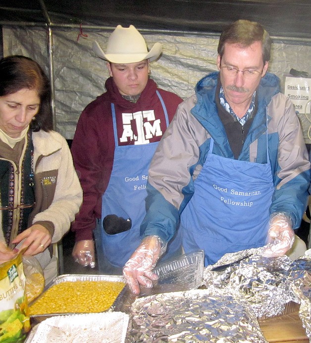 Parishioners at Good Samaritan Episcopal Church in Sammamish prepare food for residents of Tent City as a birthday party honoring Rev. Dr. Suzi Robertson