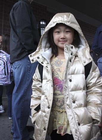 Mina Lee stands ready to start first grade at Grand Ridge Elementary.