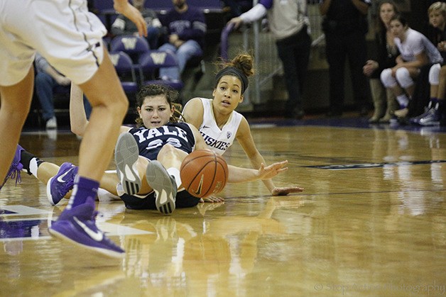 Issaquah Eagles 2014 graduate Mackenzie Wieburg dives on a loose ball for the University of Washington Huskies women’s basketball team during her freshman season in a contest against Yale in November of 2014. Wieburg