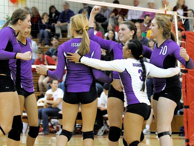 The Issaquah Eagles volleyball team reacts to winning the regular season Kingco 4A title after beating Newport 3-0 in Bellevue on Monday.