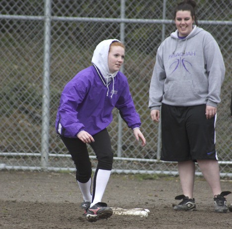 Issaquah’s Brielle Bray works on base running drills earlier this week while Stephanie Balkman looks on.