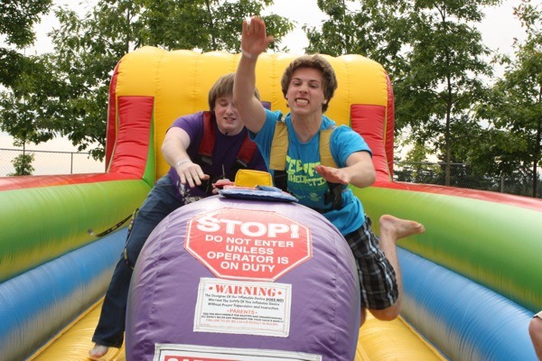 Nick Spinelli edges friend Andrew Tabit in a bungee relay at Teenfest.