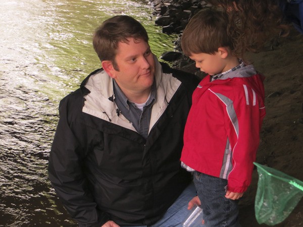 King County ecologist Hans Berge talks to his son