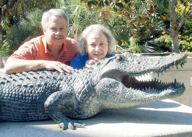 Steve Rajtar and Gayle Prince Rajtar pose with one of their beloved gators.
