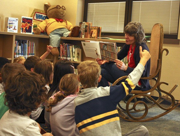 Mary Berry reads to a group of second grade students earlier this week in the new Challenger Elementary library story area