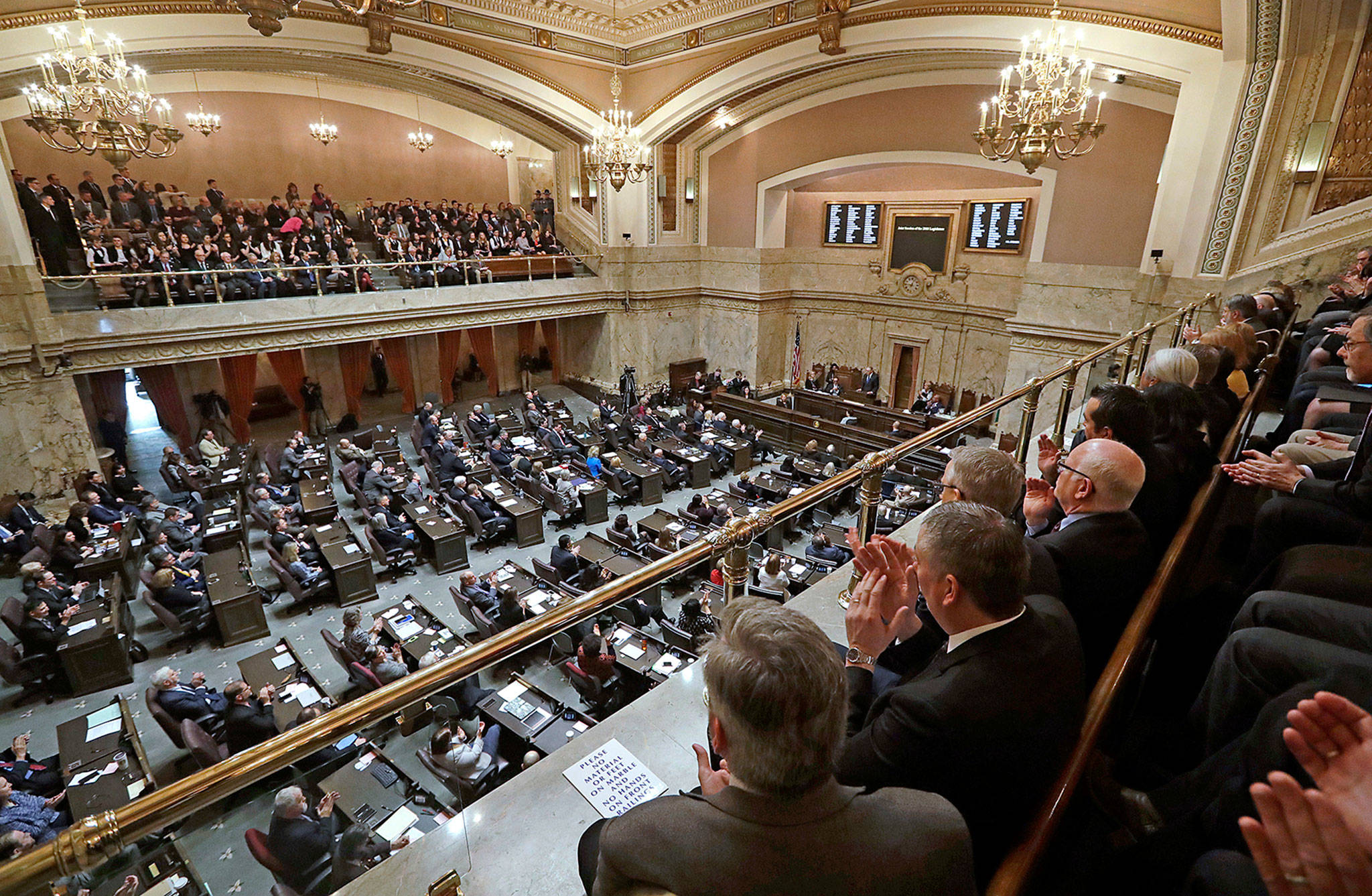 Viewers in the gallery applaud as Gov. Jay Inslee makes his annual state-of-the state address before a joint legislative session Tuesday in Olympia. (Elaine Thompson / Associated Press)